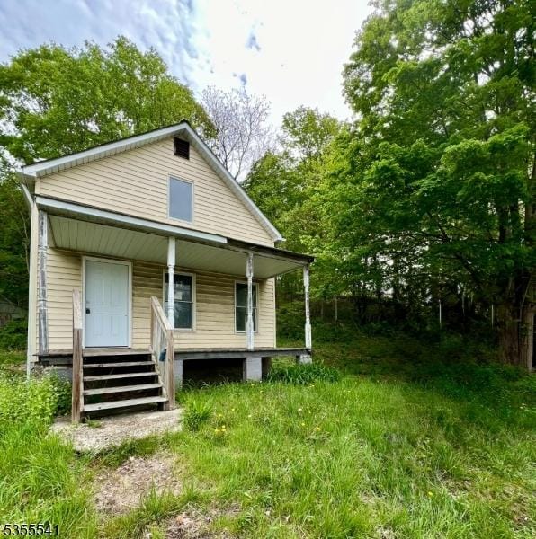 rear view of house with a porch