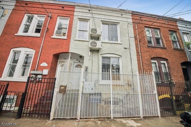126 Highland Ave, Newark City, NJ 07104 - view of front of property featuring brick siding, a fenced front yard, and a gate
