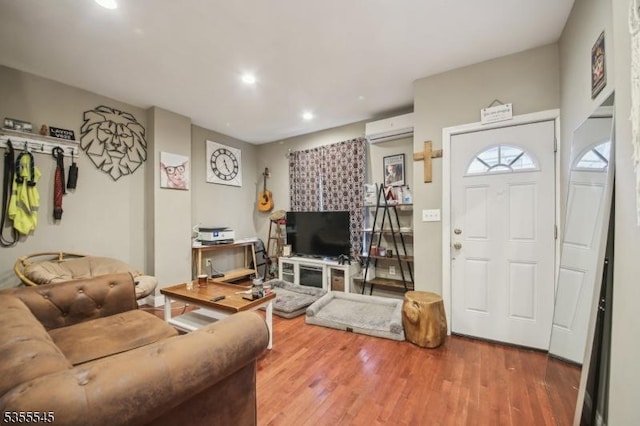 126 Highland Ave, Newark City, NJ 07104 - living area featuring a wall mounted AC, wood finished floors, and recessed lighting