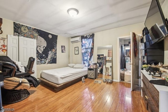 126 Highland Ave, Newark City, NJ 07104 - bedroom featuring a wall mounted air conditioner and hardwood / wood-style floors