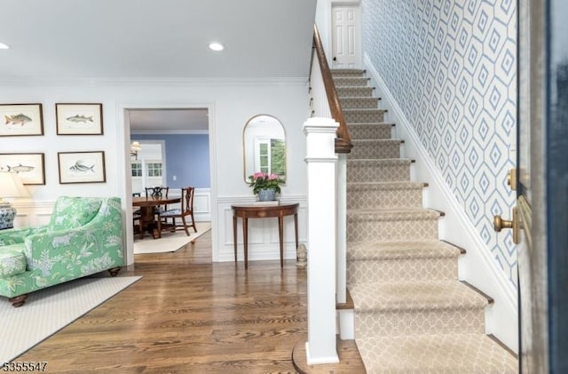 9 Warwick Rd, Chatham Twp, NJ 07928 - staircase with ornamental molding, wainscoting, wood finished floors, a decorative wall, and recessed lighting