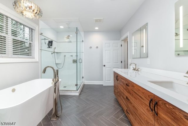 9 Warwick Rd, Chatham Twp, NJ 07928 - full bathroom featuring a shower stall, double vanity, a freestanding tub, recessed lighting, and baseboards
