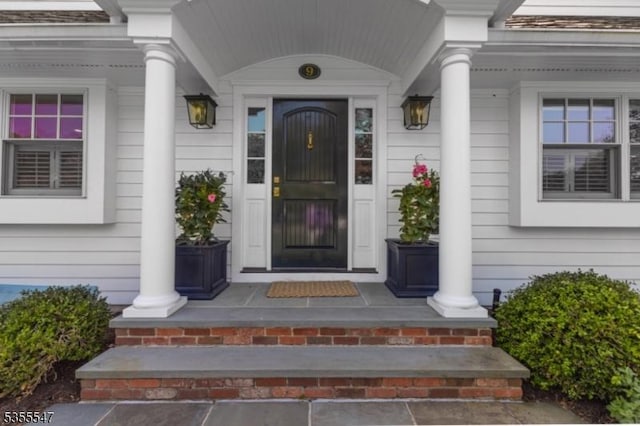 9 Warwick Rd, Chatham Twp, NJ 07928 - view of exterior entry with a porch