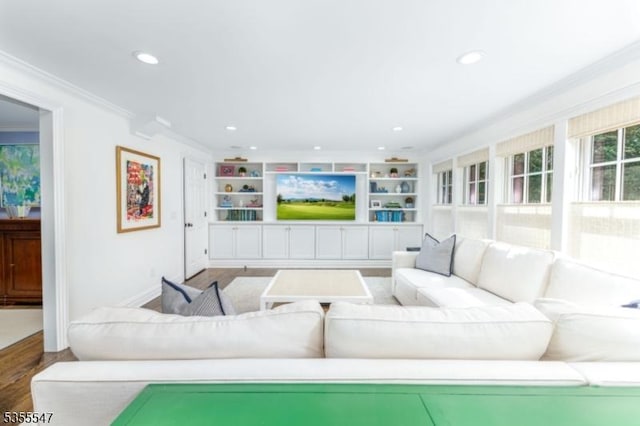 9 Warwick Rd, Chatham Twp, NJ 07928 - living area with crown molding, wood finished floors, recessed lighting, built in shelves, and baseboards