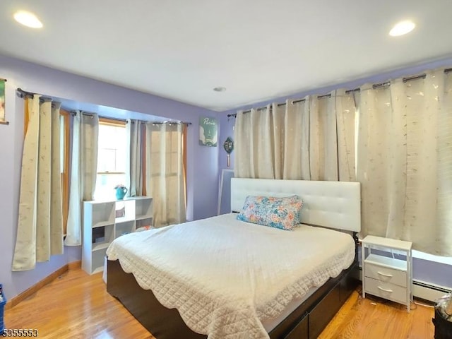 133 River Rd, Montague Twp, NJ 07827 - bedroom with a baseboard radiator, light wood-style floors, and recessed lighting