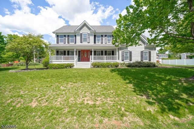 colonial-style house featuring covered porch