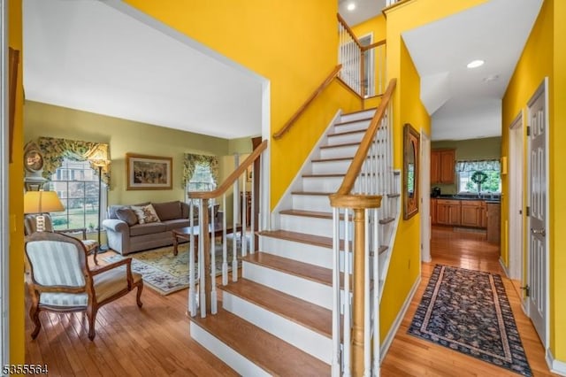 staircase featuring hardwood / wood-style flooring