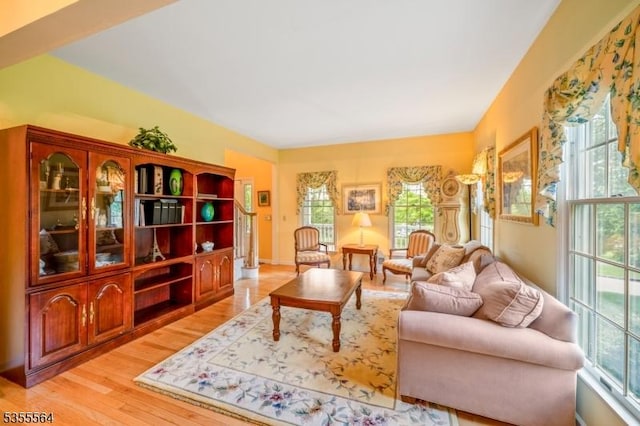 living area with plenty of natural light and light wood finished floors