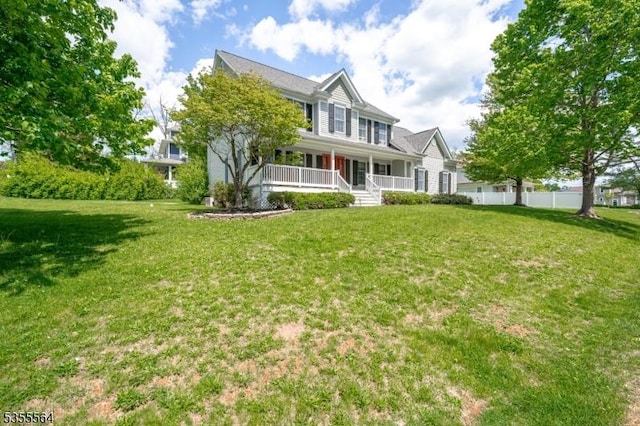 rear view of house featuring a porch