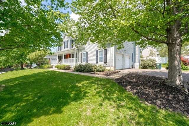 view of property hidden behind natural elements featuring a porch, driveway, and an attached garage