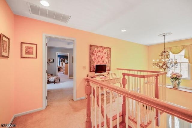 hall with an upstairs landing, light colored carpet, a chandelier, baseboards, and recessed lighting