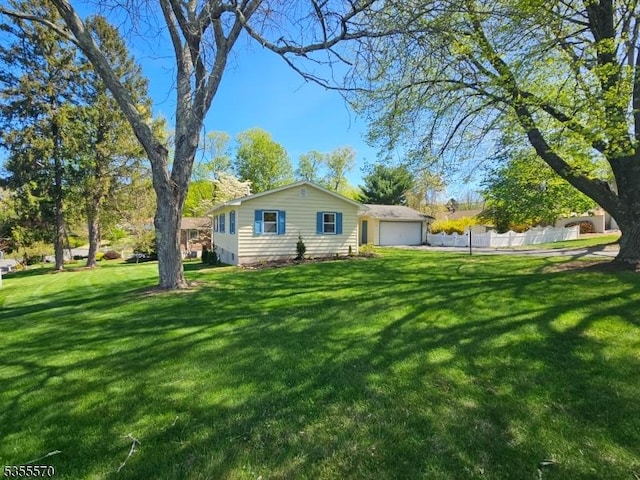 back of property featuring a lawn