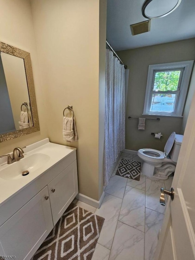 full bathroom featuring marble finish flooring, toilet, vanity, baseboards, and a shower with curtain