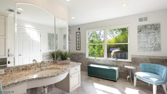 10 Stacy Dr, Montgomery Twp, NJ 08502 - bathroom with tile walls, recessed lighting, wainscoting, tile patterned flooring, and vanity