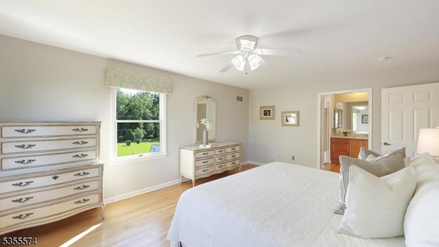 10 Stacy Dr, Montgomery Twp, NJ 08502 - bedroom with light wood-style floors, baseboards, ensuite bathroom, and a ceiling fan