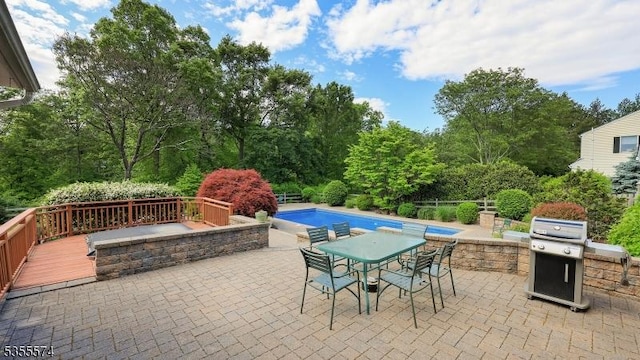 10 Stacy Dr, Montgomery Twp, NJ 08502 - view of patio / terrace featuring an outdoor pool, area for grilling, a deck, outdoor dining space, and view of scattered trees