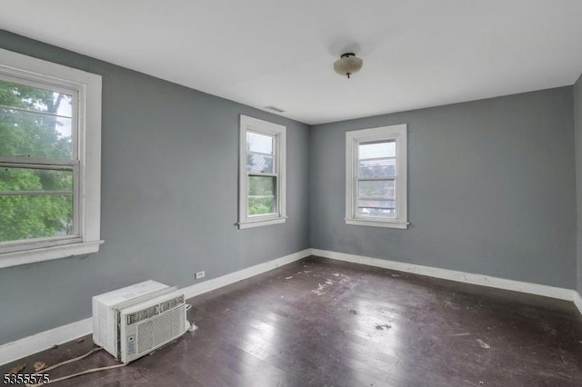 29 S Valley Rd, West Orange Twp, NJ 07052 - unfurnished room with baseboards and a wall mounted air conditioner