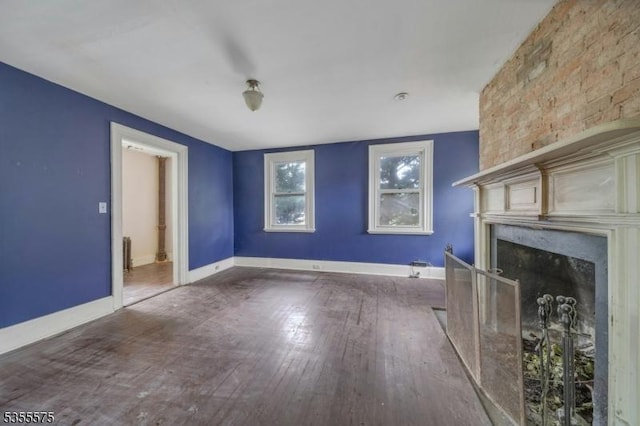 29 S Valley Rd, West Orange Twp, NJ 07052 - unfurnished living room with wood finished floors, a fireplace, and baseboards