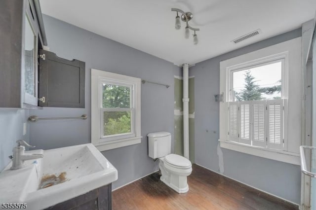 29 S Valley Rd, West Orange Twp, NJ 07052 - bathroom with wood finished floors, toilet, and vanity