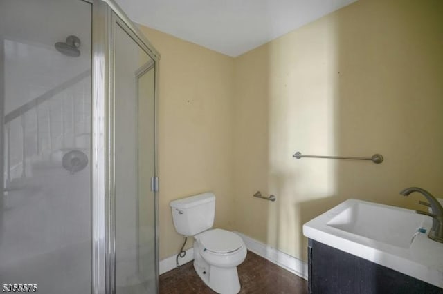 29 S Valley Rd, West Orange Twp, NJ 07052 - full bathroom with baseboards, a stall shower, toilet, and vanity