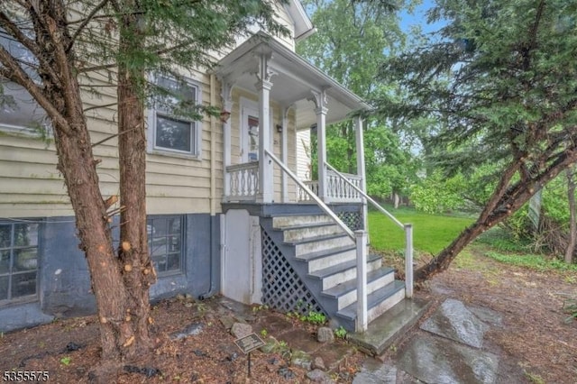 29 S Valley Rd, West Orange Twp, NJ 07052 - view of exterior entry featuring a porch and a yard