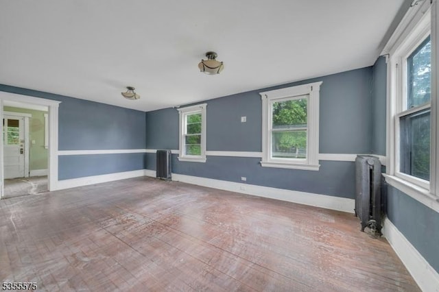 29 S Valley Rd, West Orange Twp, NJ 07052 - empty room with radiator heating unit, wood finished floors, and baseboards