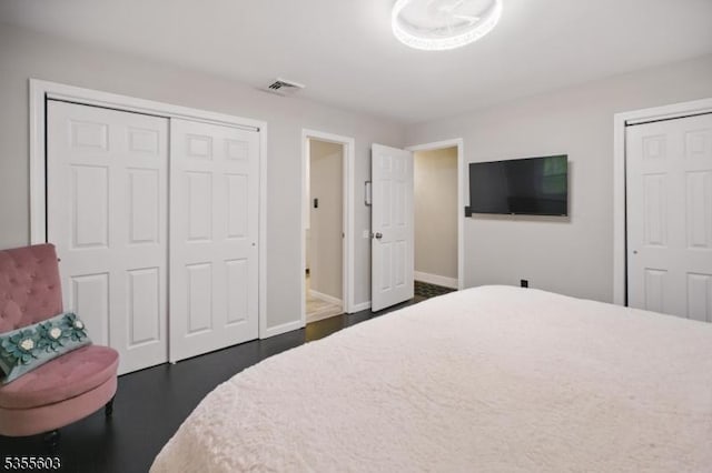 bedroom with baseboards and dark wood finished floors