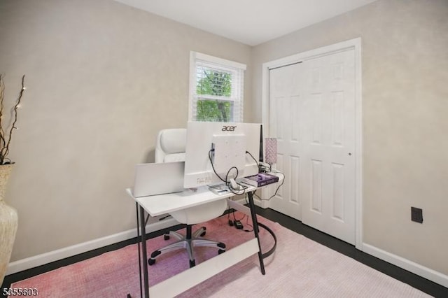 office featuring baseboards and wood finished floors