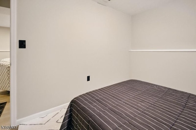 bedroom featuring baseboards