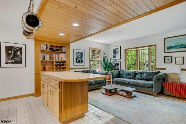 living area with wood ceiling, light tile patterned flooring, recessed lighting, and built in shelves