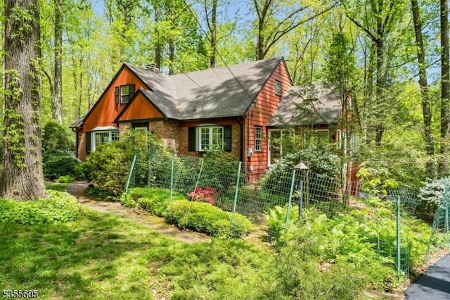 view of outbuilding featuring fence