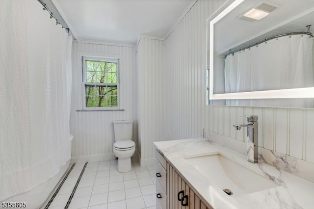 full bathroom with toilet, tile patterned floors, vanity, and a shower with shower curtain