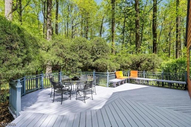 wooden deck with outdoor dining space