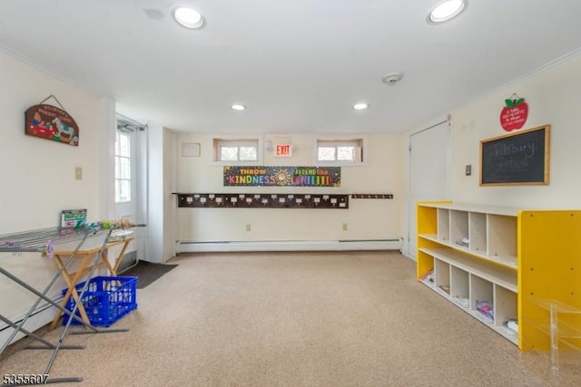 rec room featuring crown molding, recessed lighting, carpet floors, and a baseboard heating unit
