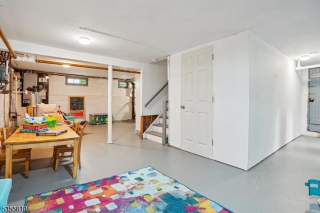 rec room with finished concrete flooring