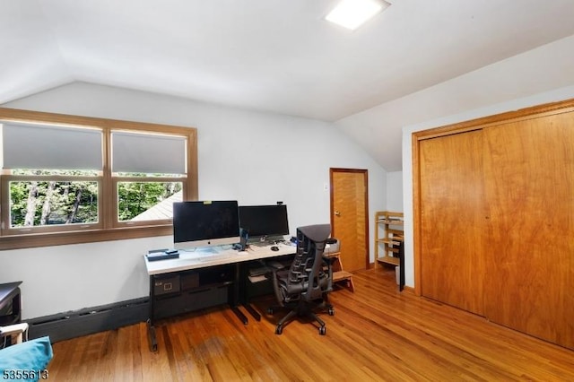 office area featuring lofted ceiling and wood finished floors