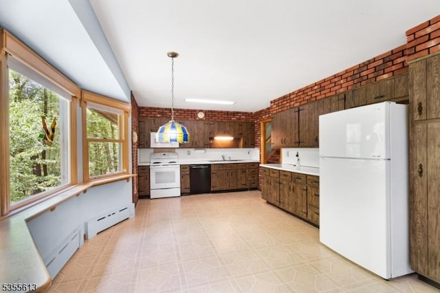 kitchen with light countertops, a sink, a baseboard heating unit, and white appliances
