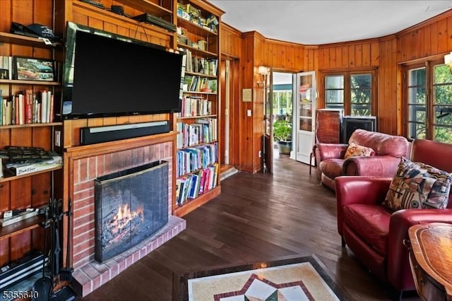 1330 Great Rd, Montgomery Twp, NJ 08540 - living room featuring wooden walls, a brick fireplace, dark wood-type flooring, and ornamental molding
