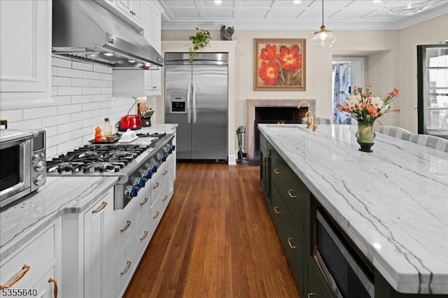 1330 Great Rd, Montgomery Twp, NJ 08540 - kitchen featuring built in appliances, under cabinet range hood, white cabinetry, decorative backsplash, and dark wood finished floors