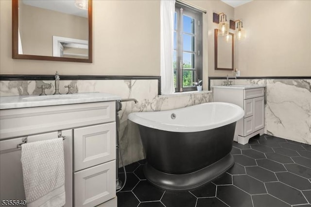 1330 Great Rd, Montgomery Twp, NJ 08540 - full bath featuring tile walls, two vanities, a wainscoted wall, a freestanding tub, and tile patterned floors