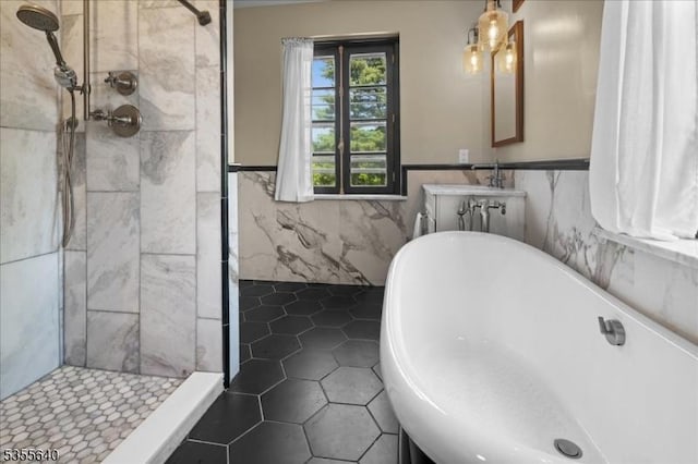 1330 Great Rd, Montgomery Twp, NJ 08540 - bathroom with a stall shower, tile patterned floors, wainscoting, a freestanding bath, and tile walls