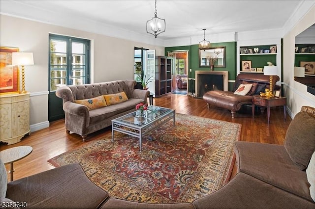 1330 Great Rd, Montgomery Twp, NJ 08540 - living area with wood finished floors, baseboards, ornamental molding, and built in features