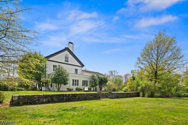 1330 Great Rd, Montgomery Twp, NJ 08540 - rear view of house featuring stucco siding, a lawn, and a chimney