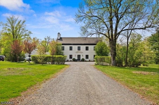 1330 Great Rd, Montgomery Twp, NJ 08540 - colonial home featuring a front yard, a chimney, and stucco siding