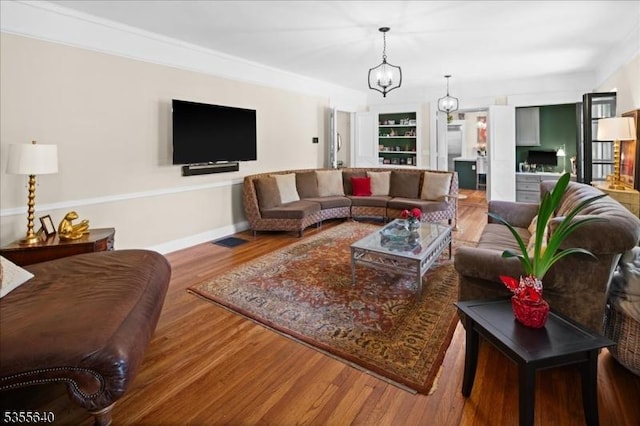 1330 Great Rd, Montgomery Twp, NJ 08540 - living area featuring wood finished floors, a chandelier, and baseboards