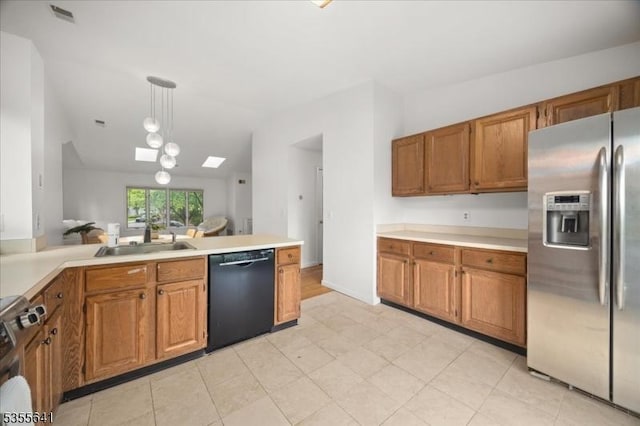 102 Westchester Ter, Clinton Twp, NJ 08801 - kitchen with stainless steel appliances, a sink, lofted ceiling, brown cabinetry, and light countertops