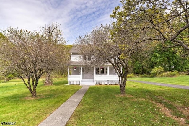 view of front of house with a porch and a front lawn