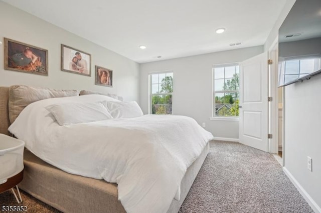 bedroom with carpet flooring, baseboards, visible vents, and recessed lighting