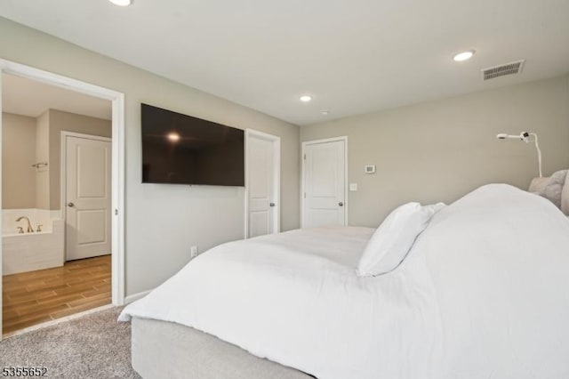 bedroom featuring visible vents, carpet floors, and recessed lighting