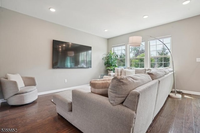 living room featuring baseboards, dark wood finished floors, and recessed lighting